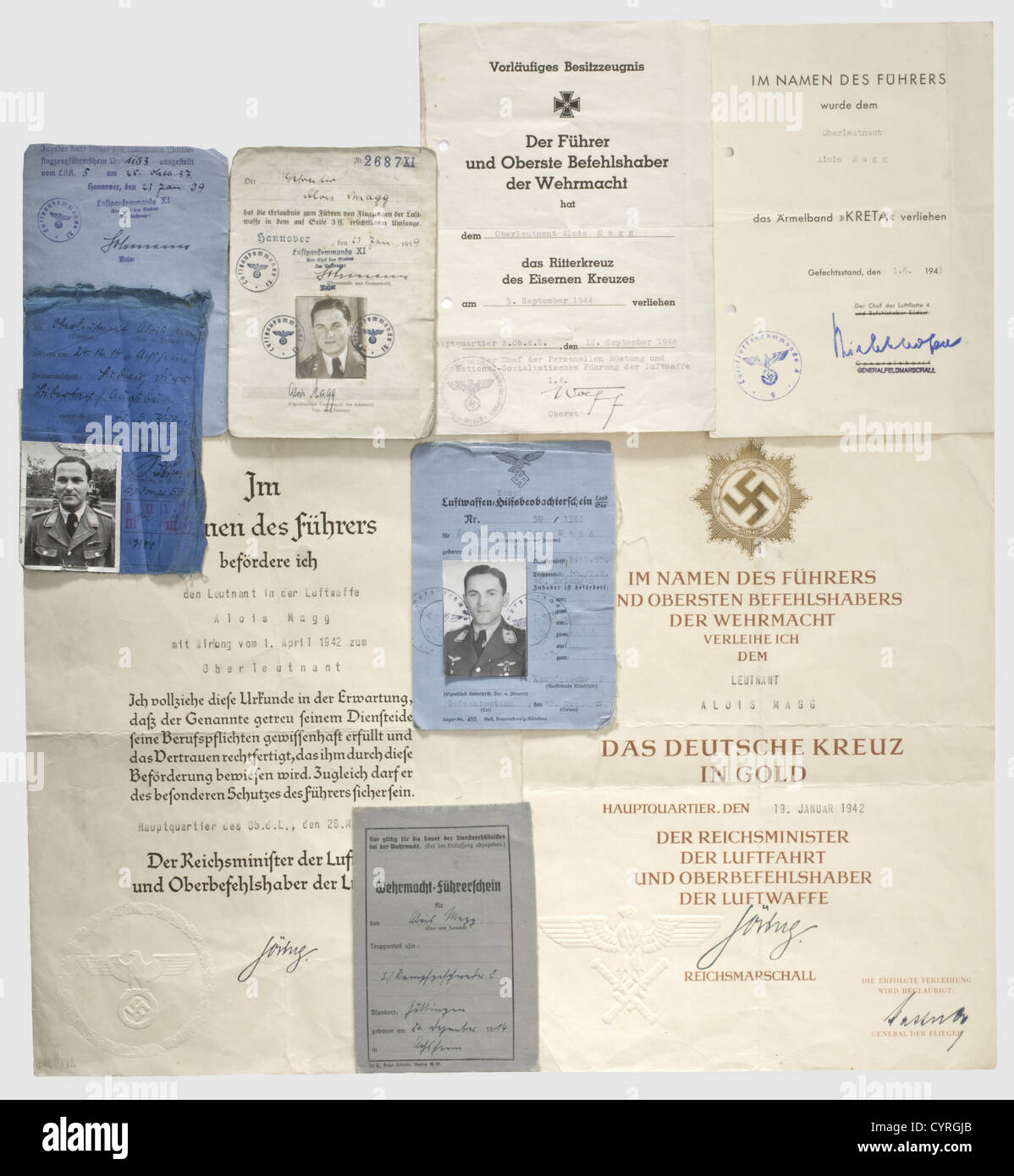 Hauptmann Alois Magg,Holder of Knight's Cross of Iron Cross,certificates and documents A preliminary certificate for Knights Cross of Iron Cross for 12 September 1944 with Wolff's signature in ink.A large decorative certificate for German Cross in Gold for 19 January 1942 with an impressed seal and Kastner's signature in ink.Certificates for 'Kreta' sleeve band for 1 June 1943 and promotion to Oberleutnant for 26 March 1942.Each folded and holed.Also his pilot's certificate for 23 January 1939 at KG(Bomber Squadron)27 'Boelcke',,Additional-Rights-Clearences-Not Available Stock Photo