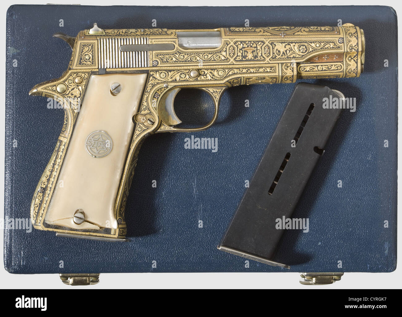 Star Mod.A in EXTRA FINO design("Gold Damascened"),in case,.38 Super Auto  cal,no.595803.Mirror-like bore.8-shot.Proof-marked "D1"(1958).Weapon on all  parts including magazine base with factory multicolour gold inlay engraving  sporting deep vine décor ...