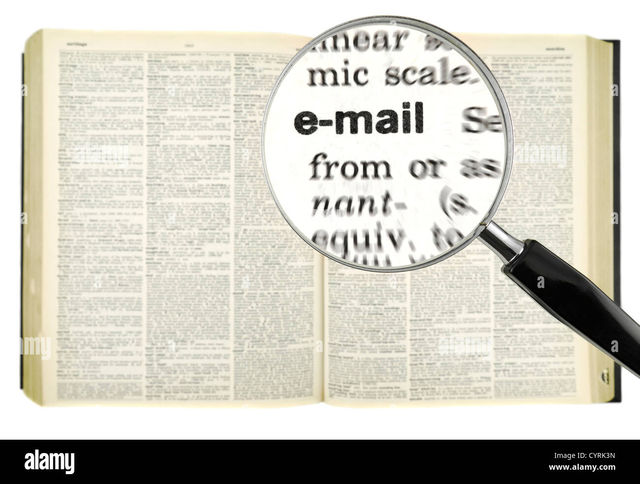 A magnifying glass on the word email on a dictionary Stock Photo Alamy