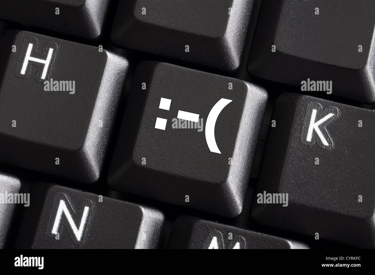 negative smilie on computer keyboard button showing bad feelings concept Stock Photo