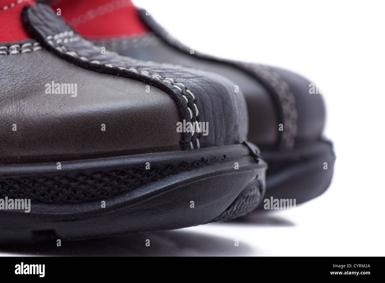 Macro view of sole of a child shoe isolated over white Stock Photo - Alamy