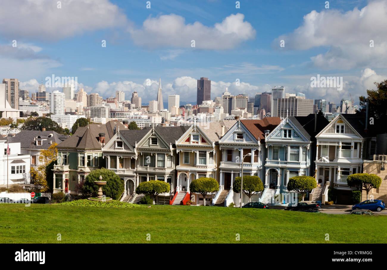 Painted Ladies with San Francisco skyline in the background as seen from Alamo Square. Stock Photo