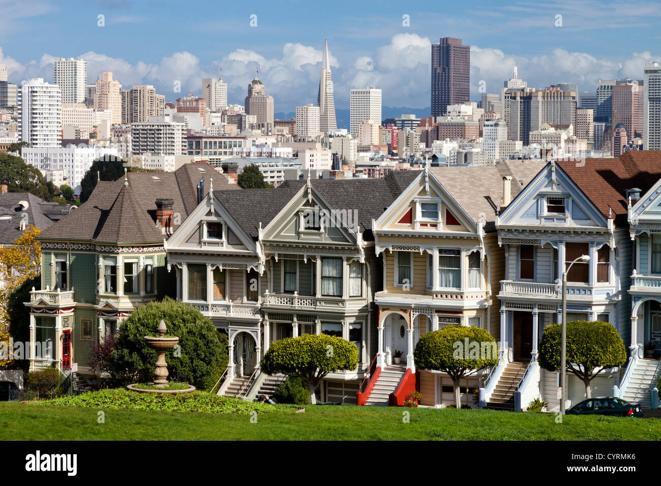 Painted Ladies with San Francisco skyline in the background as seen from Alamo Square. Stock Photo