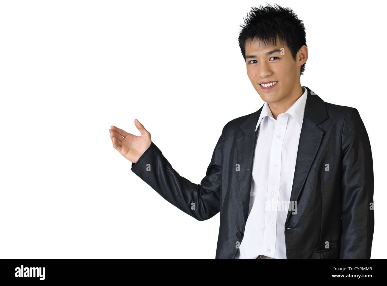 Portrait of a happy business man of Asian showing something on white background. Stock Photo