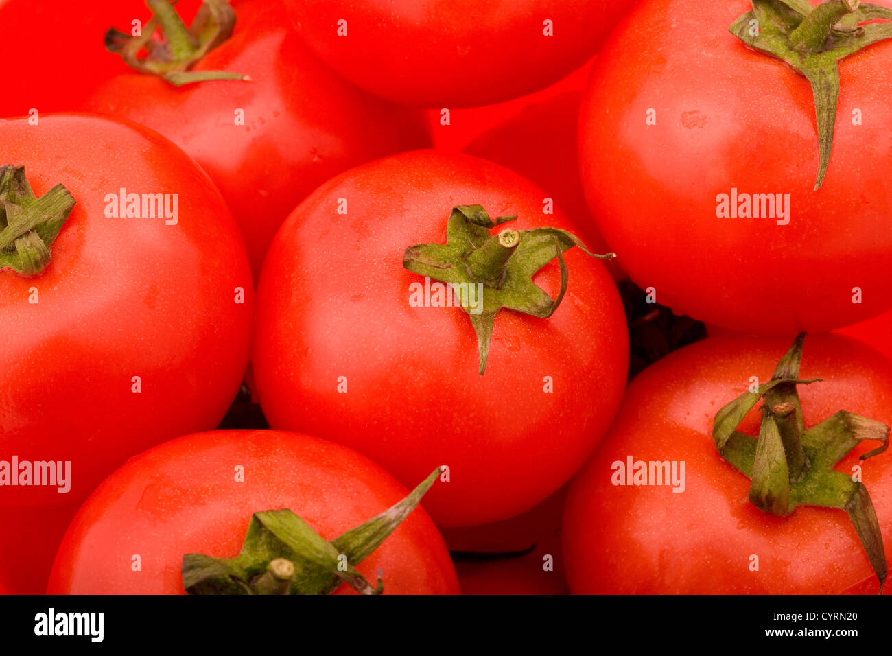 Close up of red tomatos in bowl Stock Photo - Alamy