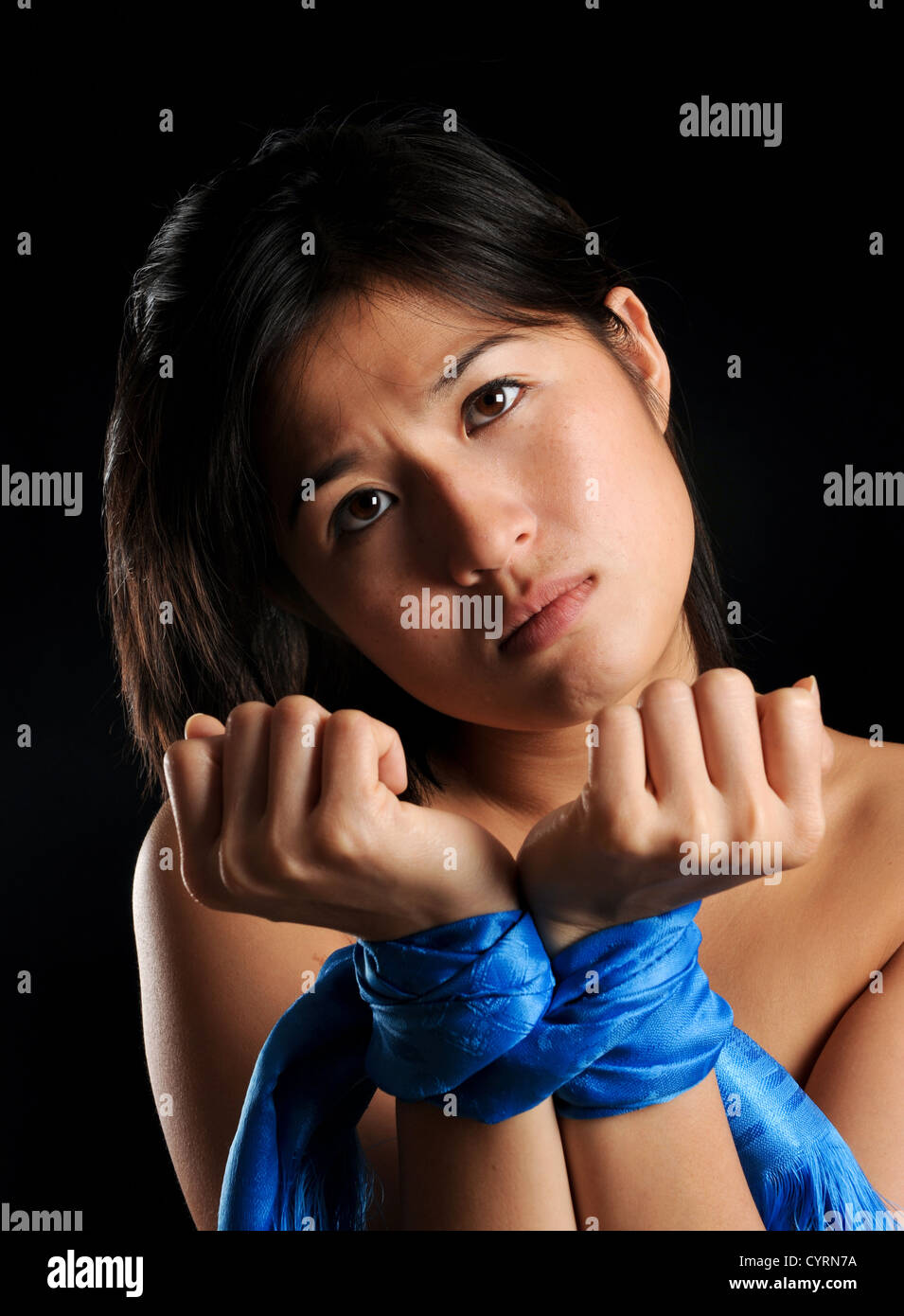Asian Girl Tied Up Against Her Will Is Unhappy Stock Photo Alamy