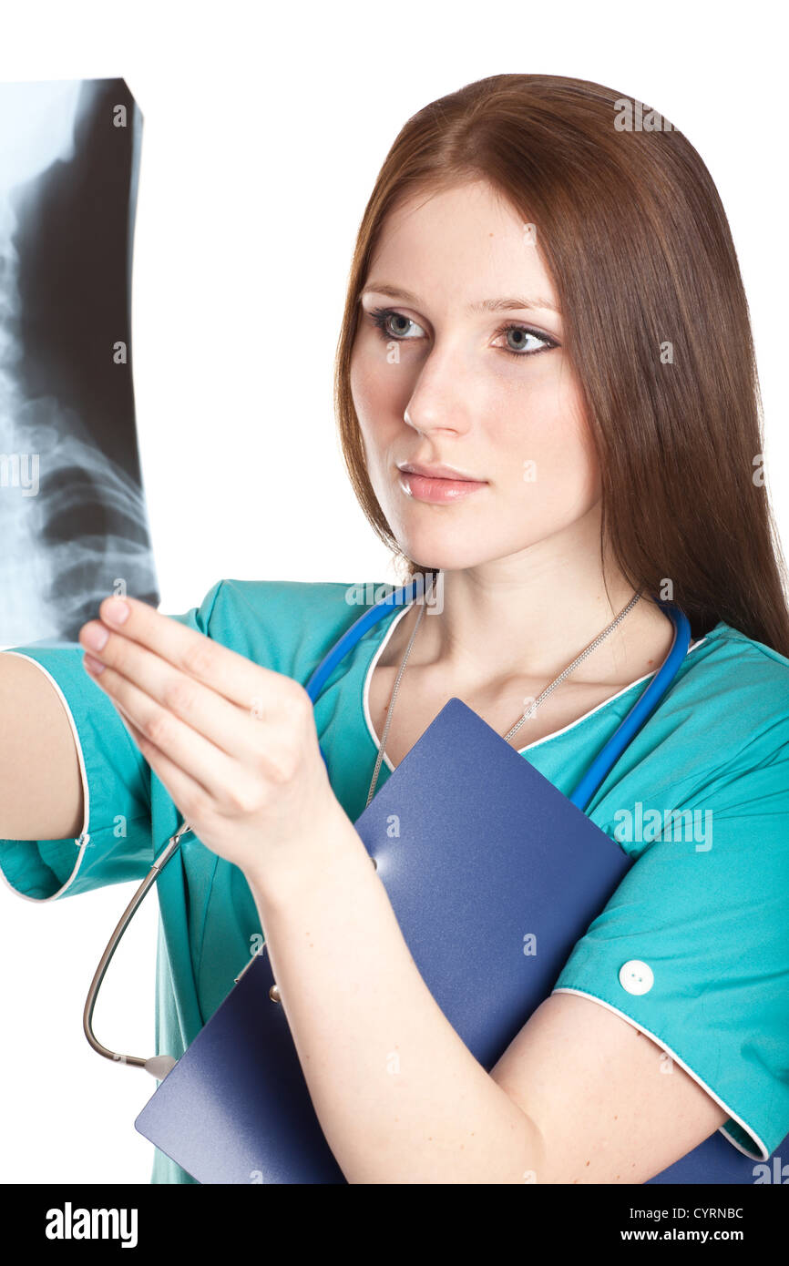 Young female doctor looking at the xray picture Stock Photo - Alamy