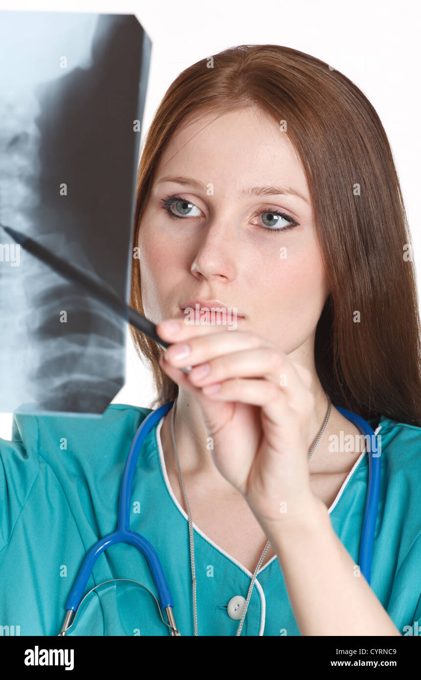 Young female doctor looking at the xray picture Stock Photo - Alamy