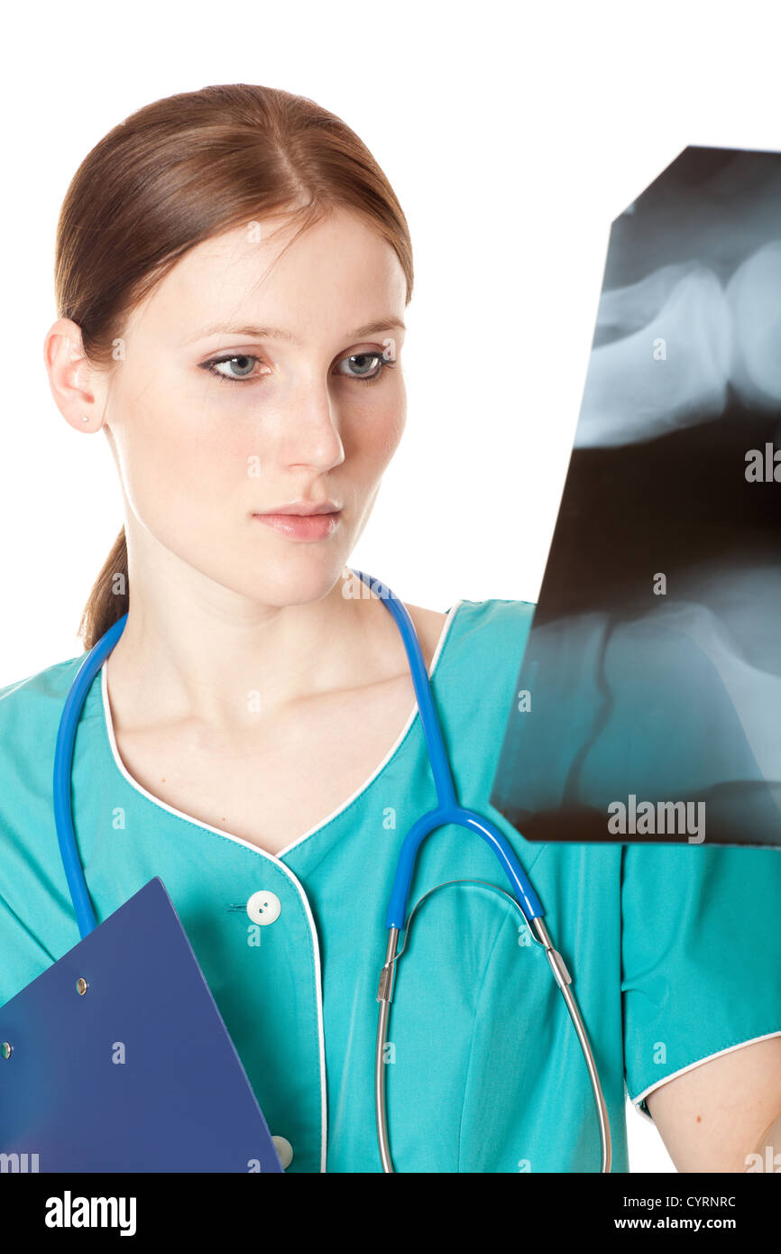 Young female doctor looking at the xray picture Stock Photo - Alamy