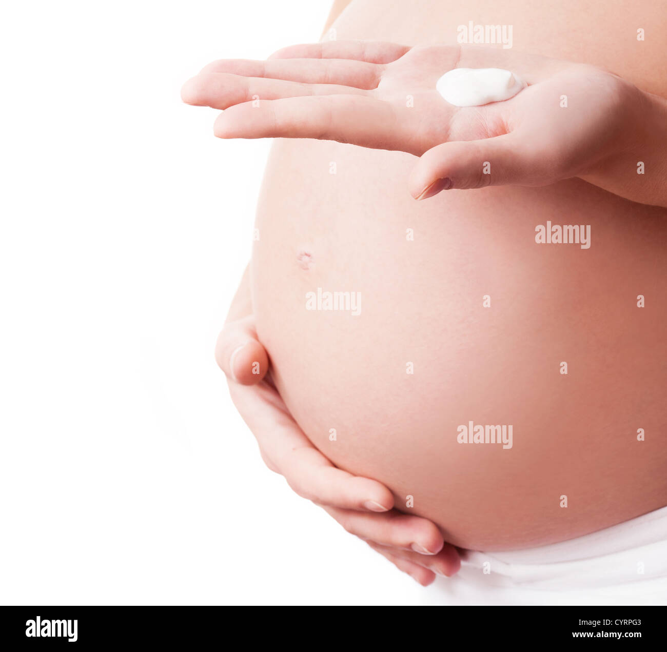pregnant woman applying body lotion Stock Photo Alamy