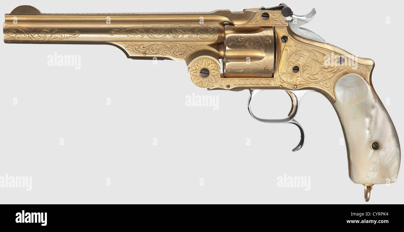 Smith & Wesson 3rd Model Russian,Commercial,engraved,gilded,mother-of-pearl grip panels,Cal..44 Russ,no.41636.Matching numbers with component no.2416.Bright five-groove rifled bore,length 6-1/2'.Six shots,fluted cylinder.On barrel rib makerïs address and patents ending in '...Aug.24.69 Russian Model',rear left on frame marked '1874'.All parts with vine engraving and renewed gold-plating.Screws and small parts blue.Hammer and trigger polished white.Matching-numbered mother-of-pearl grip panels.Cylinder stop screw replaced.Mint condition.Erw,Additional-Rights-Clearences-Not Available Stock Photo