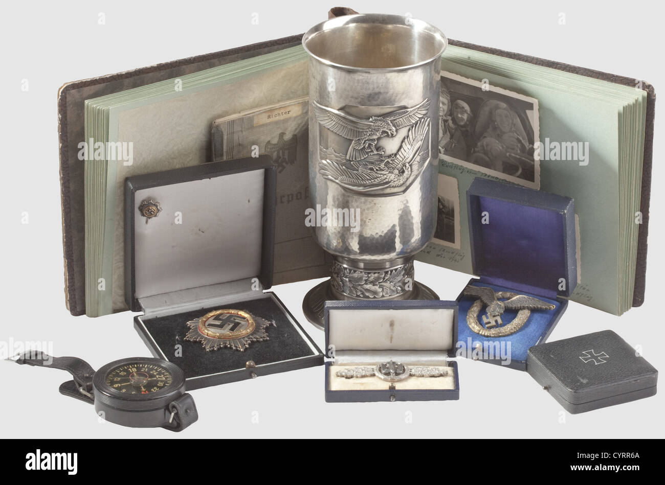Legacy of pilot Heinrich Richter(1912 - 1972),a goblet of honour,decorations and Wehrpass from 3./ KG 27 Boelcke German Cross in Gold ,maker Deschler('1')with scribed engraving 'Richter - Fw',attachment system and enamel repaired,in award presentation case. Included is the rare 16 mm miniature on a pin with maker's punch 'L/12' and a f historic,historical,1930s,20th century,Air Force,branch of service,branches of service,armed service,armed services,military,militaria,air forces,object,objects,stills,clipping,clippings,cut out,cut-out,,Additional-Rights-Clearences-Not Available Stock Photo