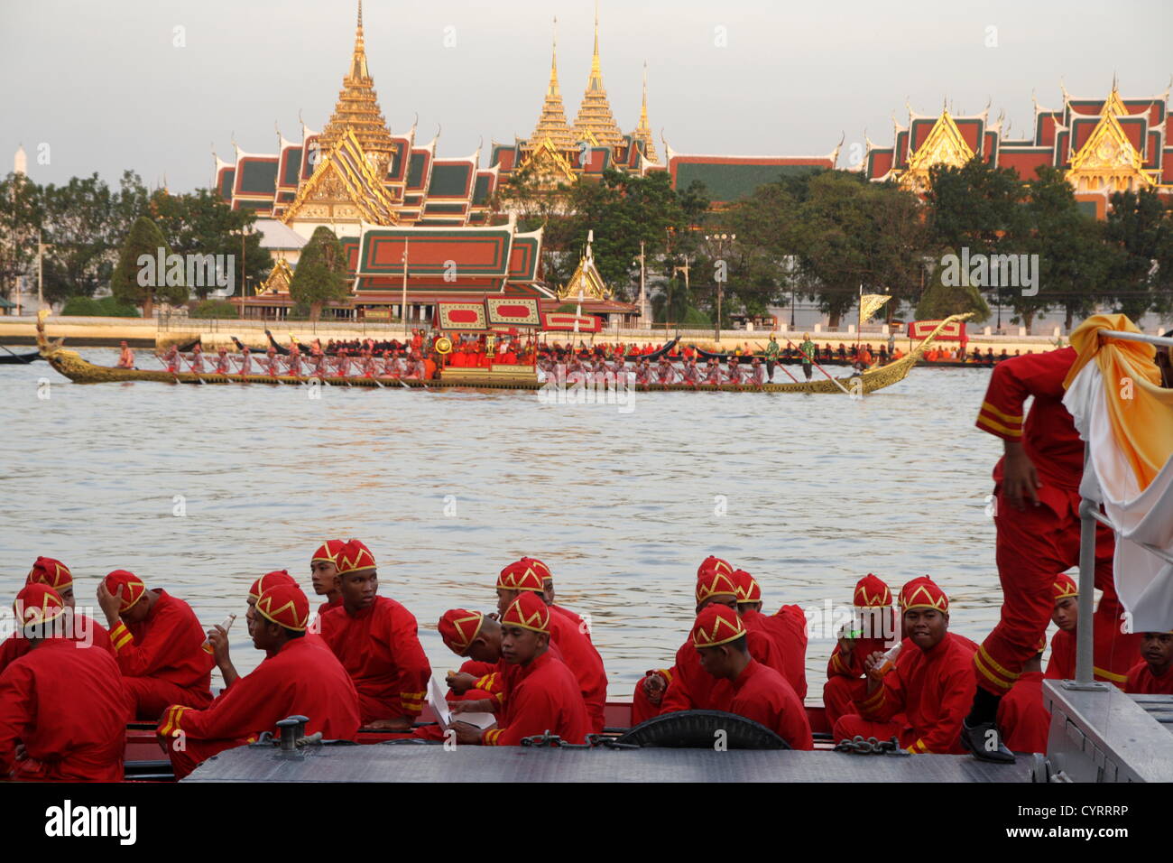 9th, November, 2012. Bangkok, Thailand. Thai sailors resting at dock after finish their duty . Over 2,000 rowers in 52 barges took part in the procession from Va Su Kri pier to Wat Arun Temple , held for the first time in five years and presided over by Crown Prince Maha Vajiralongkorn,.  The Royal Barge Procession to Present the Royal Kathin Ceremony in a part of The Celebration on the Auspicious Occasion of His Majesty the King’s 85th Birthday Anniversary 5th December 2012. Stock Photo