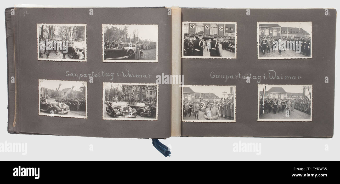 Photo album of a member of the Totenkopfverbände,Totenkopfstandarte 'Thüringen' Black album with ca.180 photos,the cover with stamped runes and lettering 'Erinnerungen an Meine Dienstzeit'.Obvious signs of pressure marks(from cap insignia,unfortunately no longer present).The album pages are mostly annotated with location and date information.The photos cover training in Weimar and Freiburg,various parades,and guard duty in concentration camp Buchenwald with images of watch towers,prohibition signs,the camp zoo,a visit from Himmler etc.The album is,Additional-Rights-Clearences-Not Available Stock Photo