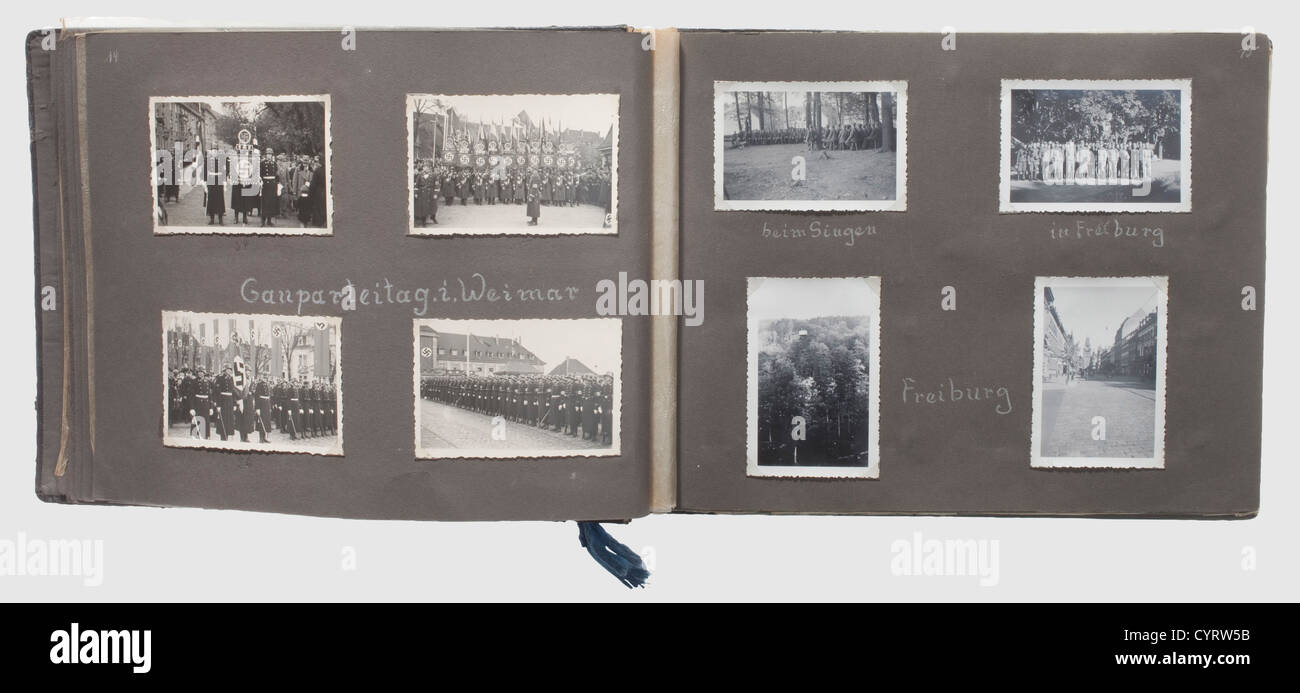 Photo album of a member of the Totenkopfverbände,Totenkopfstandarte 'Thüringen' Black album with ca.180 photos,the cover with stamped runes and lettering 'Erinnerungen an Meine Dienstzeit'.Obvious signs of pressure marks(from cap insignia,unfortunately no longer present).The album pages are mostly annotated with location and date information.The photos cover training in Weimar and Freiburg,various parades,and guard duty in concentration camp Buchenwald with images of watch towers,prohibition signs,the camp zoo,a visit from Himmler etc.The album is,Additional-Rights-Clearences-Not Available Stock Photo