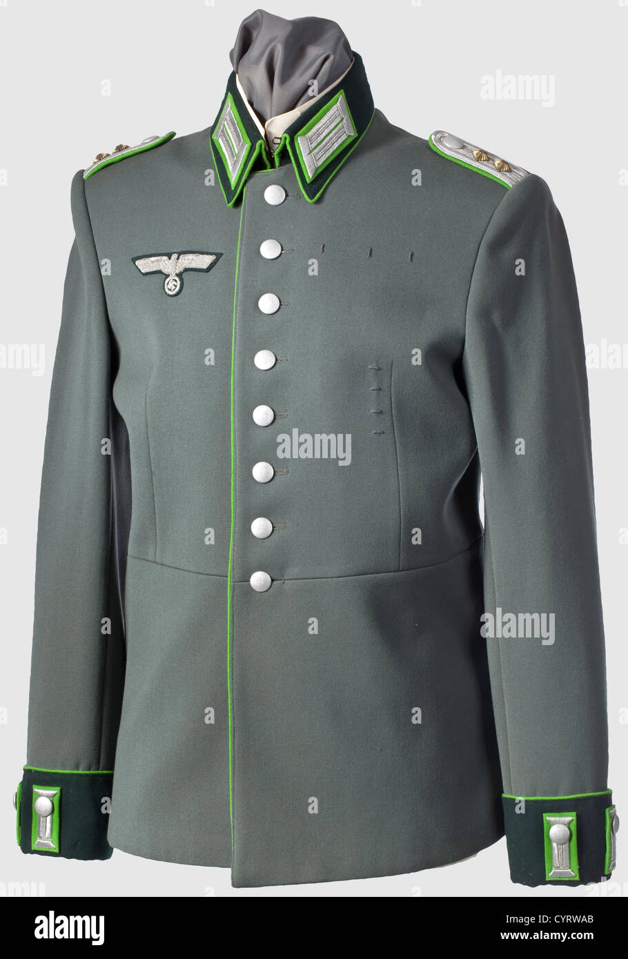 A tunic,for a captain of the panzer grenadiers Personal property piece of fine field-grey cloth with dark green collars and cuffs,meadow-green piping on collars,button fly,cuffs and coat tails. The insignia likewise with meadow-green underlay and silver embroidery,several order loops present,green silk lining. Also comes with a button-on collar and a pair of dress gloves . The meadow-green colour for Panzer Grenadiers was introduced in 1942. Thus,a tunic for this branch of service,and especially in mint condition,is correspondingly rare,historic,hist,Additional-Rights-Clearences-Not Available Stock Photo
