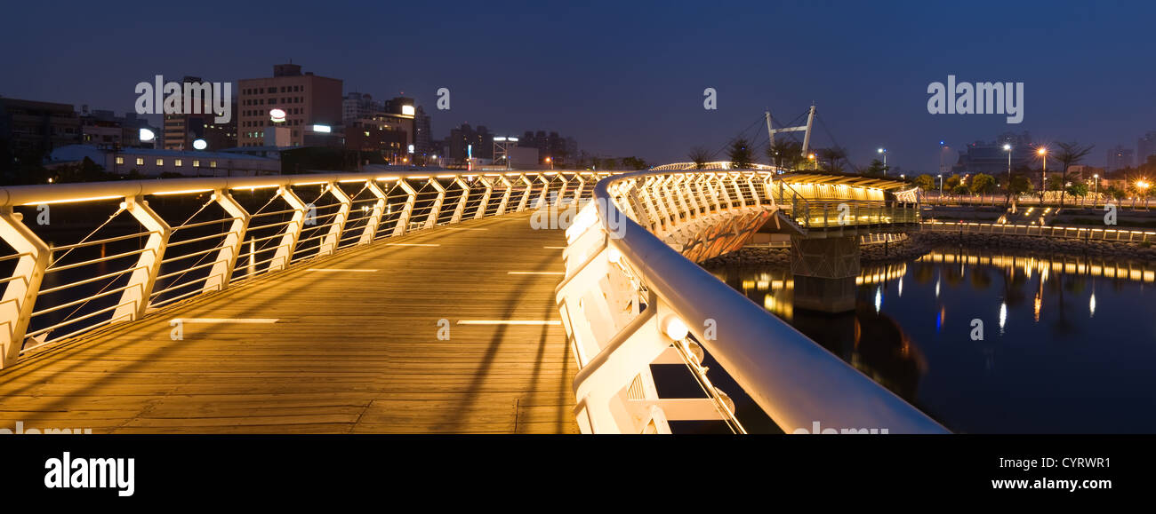 Panoramic night scene with color of bridge in city Stock Photo - Alamy