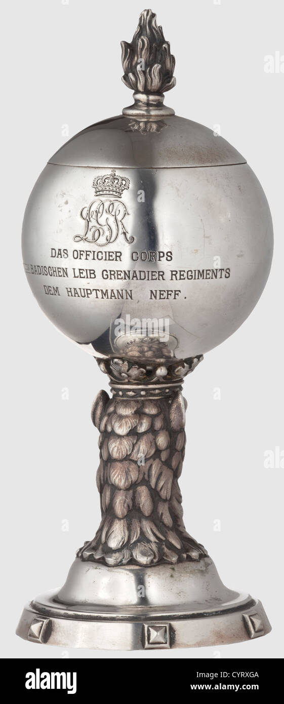 1st Baden Life Guards Grenadier Regiment,an honorary silver beaker circa 1900 Three-dimensional,crowned gryphon's head,carrying a ball with the royal Baden coat of arms.On the reverse side the engraved coat of arms of the regiment and the inscription "DAS OFFICIER CORPS I ten BADISCHEN LEIB GRENADIER REGIMENTS DEM HAUPTMANN NEFF".The removable lid with screwed-on flame.No punchmark,but tested for silver.Height 18.5 cm,weight 269 g.Extremely sophisticated and expressive beaker of the most distinguished Baden regiment,historic,historical,1900s,20th ,Additional-Rights-Clearences-Not Available Stock Photo