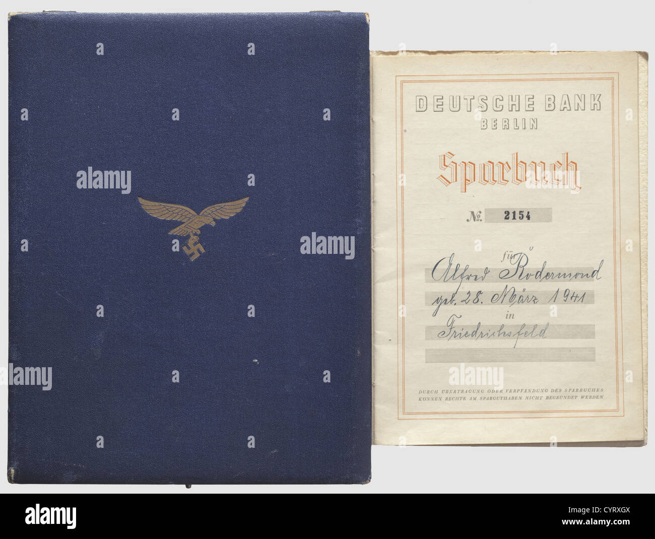 Reichsmarschall Hermann Göring,a cased bank savings book,Deutsche Bank Berlin Issued to the son(born in 1941)of a killed JU-88 bombardier. Bestowed 'Kriegsweihnachten 1941'(Christmas 1941),numbered '2154'. Cardboard cover with gold-stamped Reich Marshal Eagle,prefaced by Hitler and Göring,with entries for 1,000 RM and for accrued interest in 1942. In the rare blue case(slightly knocked)with gold-stamped Luftwaffe eagle on the cover and an Iron Cross of 1939 inside. Velvet and silk liner. A rare,complete set,historic,historical,1930s,20th century,,Additional-Rights-Clearences-Not Available Stock Photo