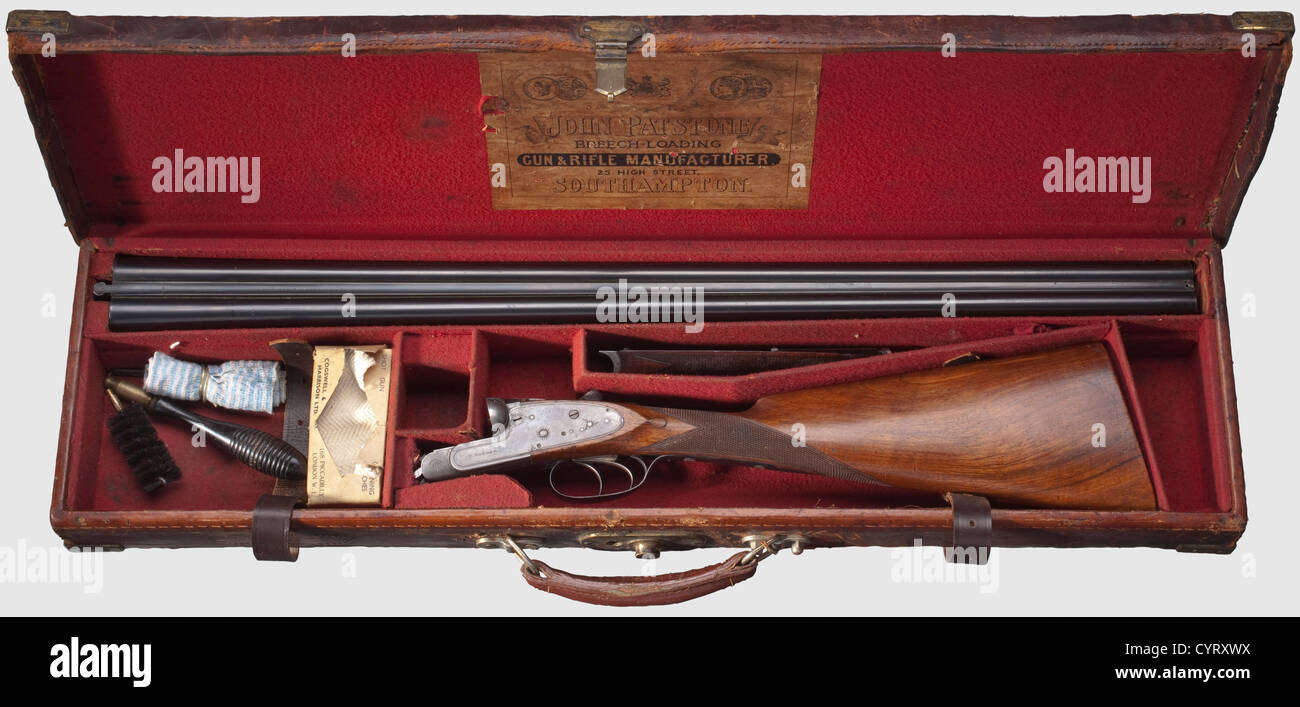 A Walker double-barreled shotgun,with Purdey barrels,cal. 12,no. 54673. Somewhat rough,reworked bores with usage marks,proof-marked London and Birmingham. Indistinct manufacturer's name 'Purdey' on barrel rib,no front sight. Barrel length 76 cm. Breech with double barrel hook lockings,side-locks with removed indicator,double trigger. Automatic slide safety on stock wrist(faulty). Ornamentally cut and sparsely engraved frame and bolt plates,signed 'W.Walker' on both sides. Finely grained English stock also with usage marks,distance trigger - centre of,Additional-Rights-Clearences-Not Available Stock Photo