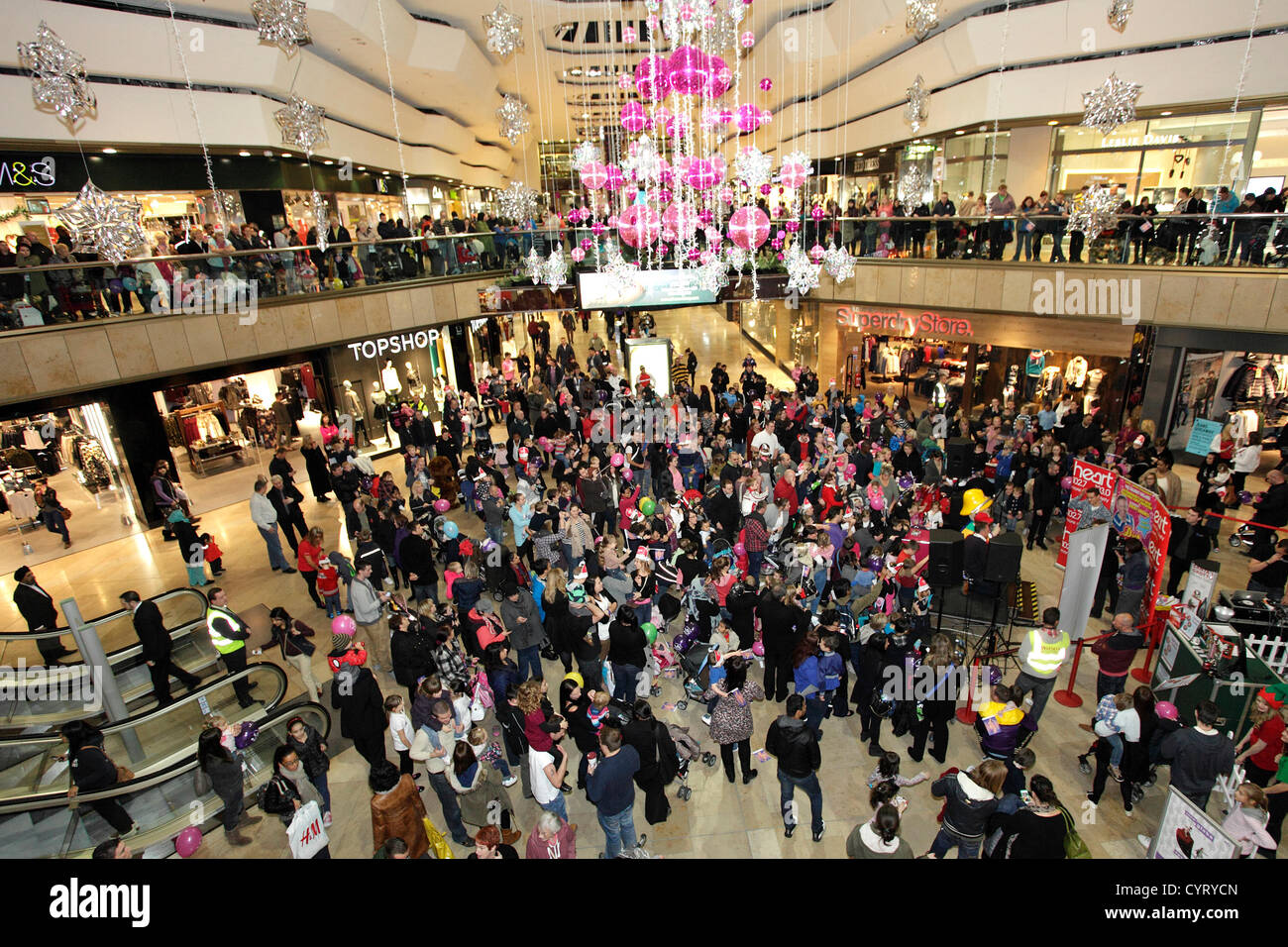 Crowds and decorations at the switch on of Queensgate shopping centres  Christmas lights, Peterborough, Cambridgeshire, England. 08 11 2012 Stock  Photo - Alamy