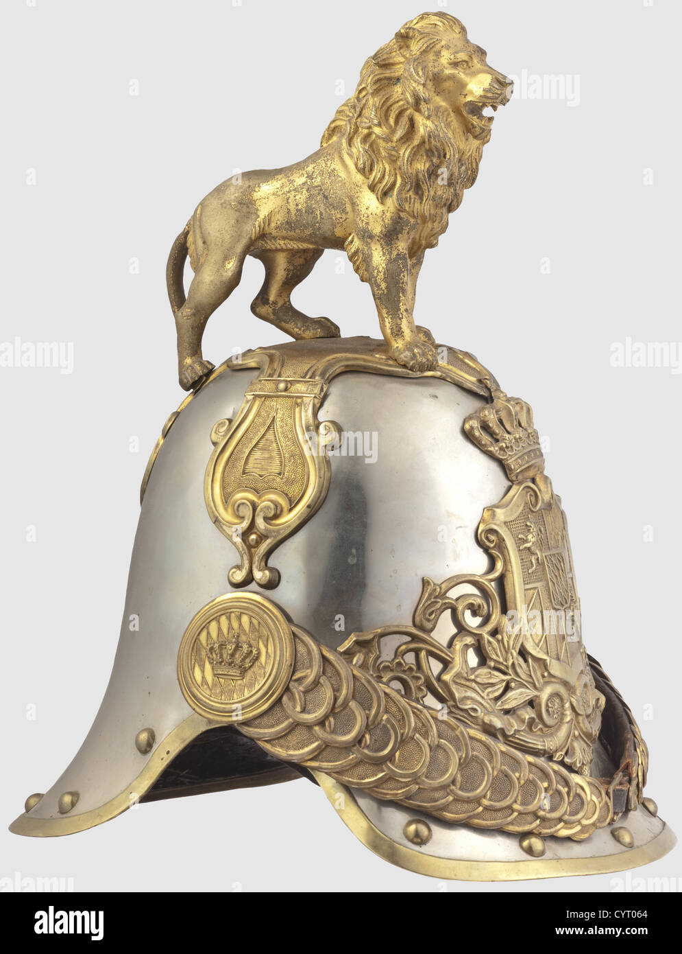 A M 1852 helmet,of Royal Bavarian Hartschiere Life Guards Version for enlisted men and sergeants in large parade version with rampant lion.Skull of nickel-silver with gold plated fittings,border and continuous rivets.Applied large helmet plate with Bavarian coat of arms surmounted by a crown.Chinscales with original leathering on embossed crown rosettes(strap added).The cruciform base plate richly decorated with ornaments and made of several pieces,a striding lion with struck number '29' under left front paw and no.'49' on inside of,Additional-Rights-Clearences-Not Available Stock Photo