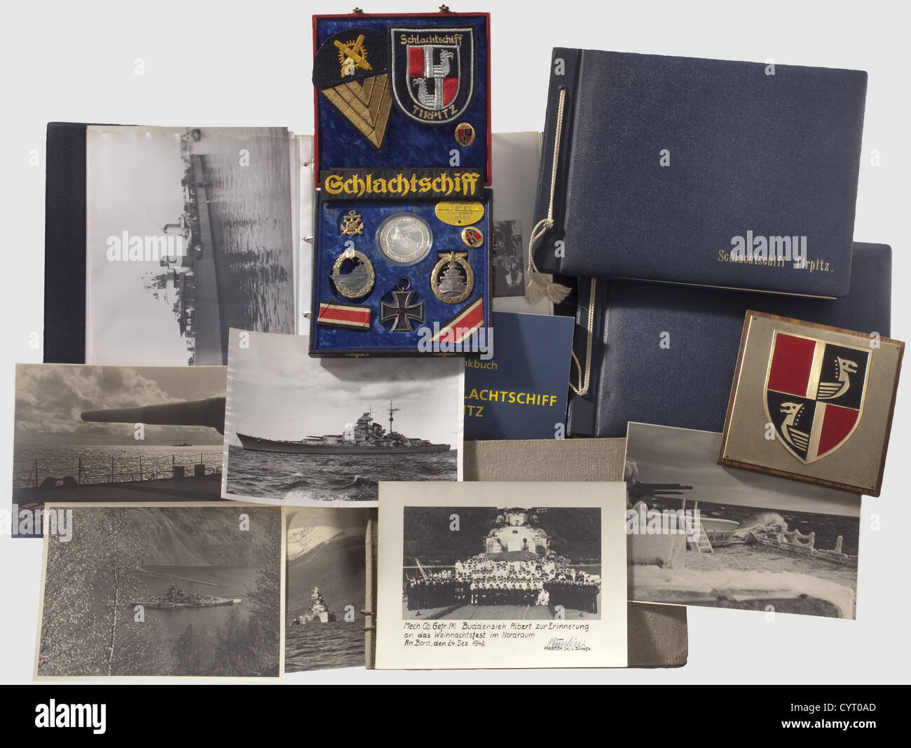 Battleship Tirpitz,orders,certificate and photo albums Comprehensive legacy from the property of a crew member of the 'TIRPITZ',Maschinen-Obergefreiter(engineer PFC)(Artillery)Albert Buddensiek. Including the orders: Fleet War Badge in nonferrous metal with maker's ID 'Fec. Adolf Bock Ausf. Schwerin Berlin',incl. award certificate issued on 11 Sept. 1943 with the original signature of Admiral Kummetz historic,historical,1930s,20th century,navy,naval forces,military,militaria,branch of service,branches of service,armed forces,armed service,obj,Additional-Rights-Clearences-Not Available Stock Photo
