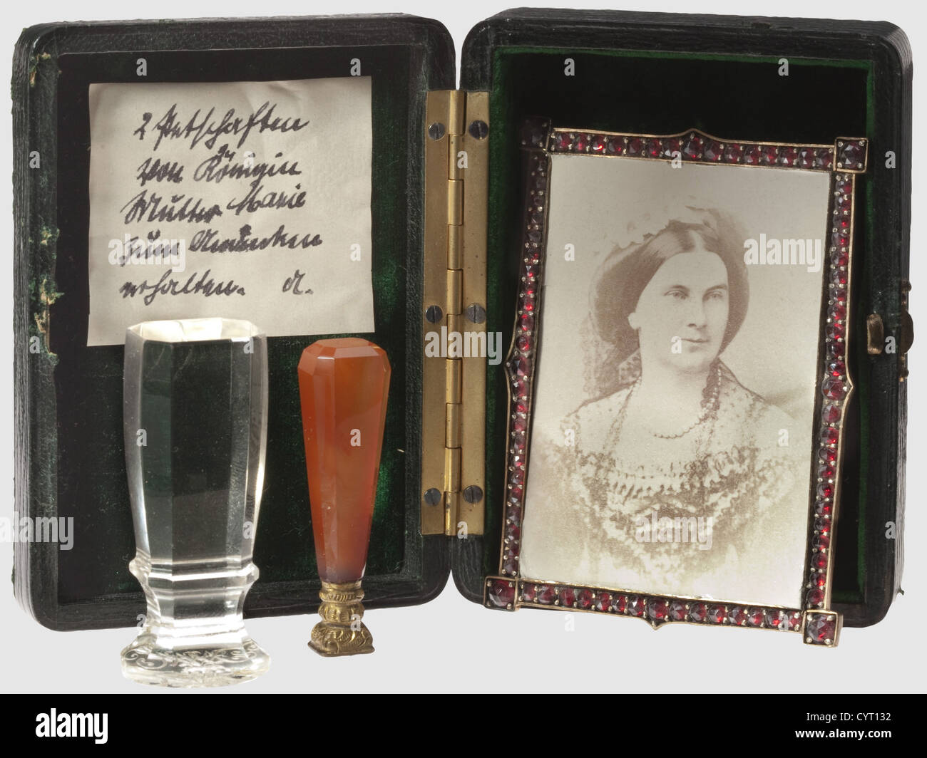 King Maximilian II and Queen Marie of Bavaria, portrait photographs with garnet frame and two personal seals A small-format photograph of the queen wearing a lace dress (circa 1860/70), in a small, gilt brass frame richly studded with cut garnet stones, the reverse side of the frame is open and shows a portrait picture of the King in plainclothes. Dimensions 77 x 57 mm, complete with supporting stand. With it two seals of the queen, one delicate exemplar with monogram 'M' under the royal crown and orange-brown agate handle with a gilt root, height 41 mm, as wel, Stock Photo