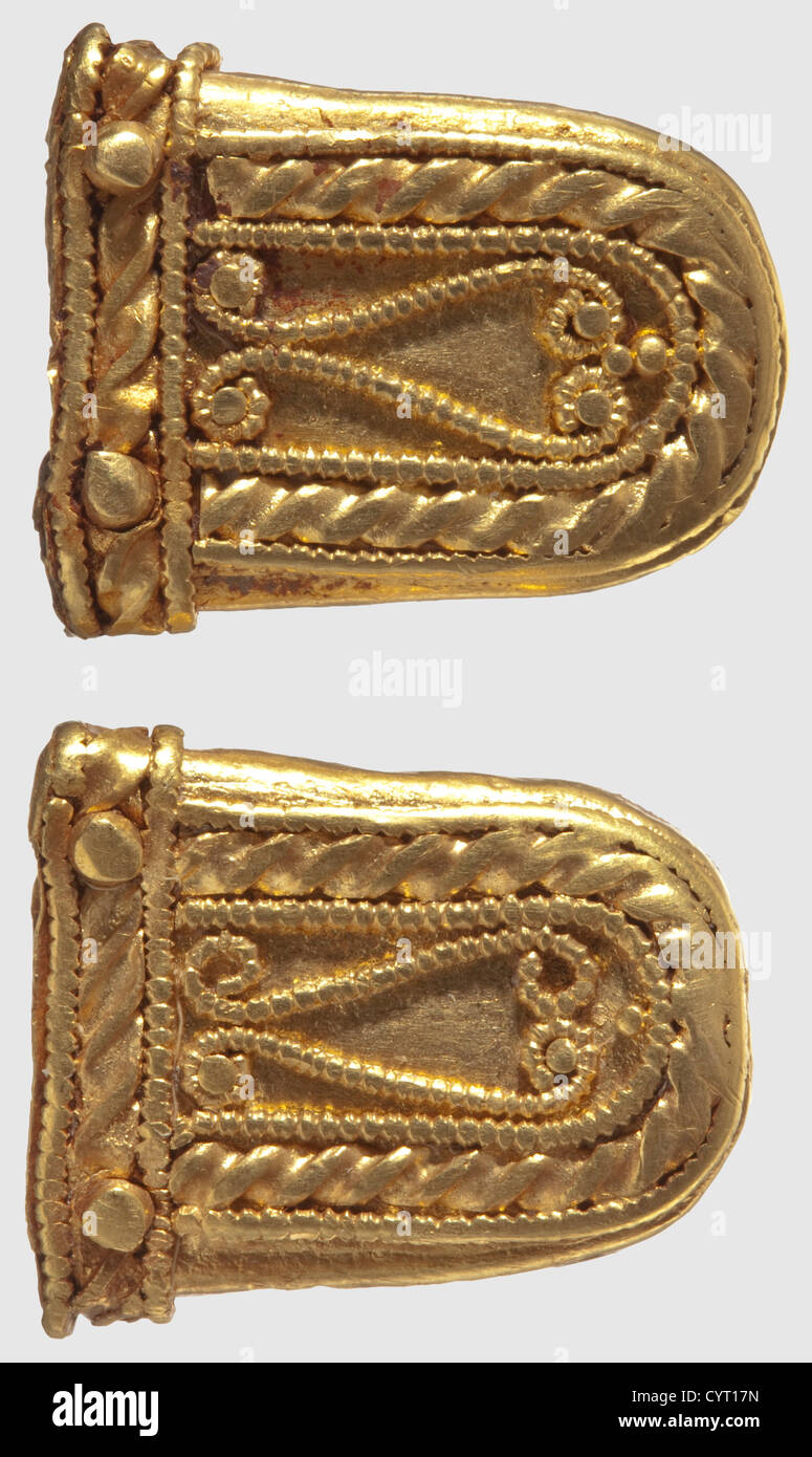 Two golden strap endings, Migration Period, 5th/6th century. The outside of the fittings is elaborately decorated with gold wire, and each has retained two gold rivets. Length of each 2.1 cm. Total weight 12.5 g. Provenance: Private collection in Southern Germany, acquired in the 70s and later, historic, historical, ancient world, ancient world, ancient times, object, objects, stills, clipping, cut out, cut-out, cut-outs, mediterranean, precious metal, precious metals, jewellery, jewelry, Additional-Rights-Clearences-Not Available Stock Photo
