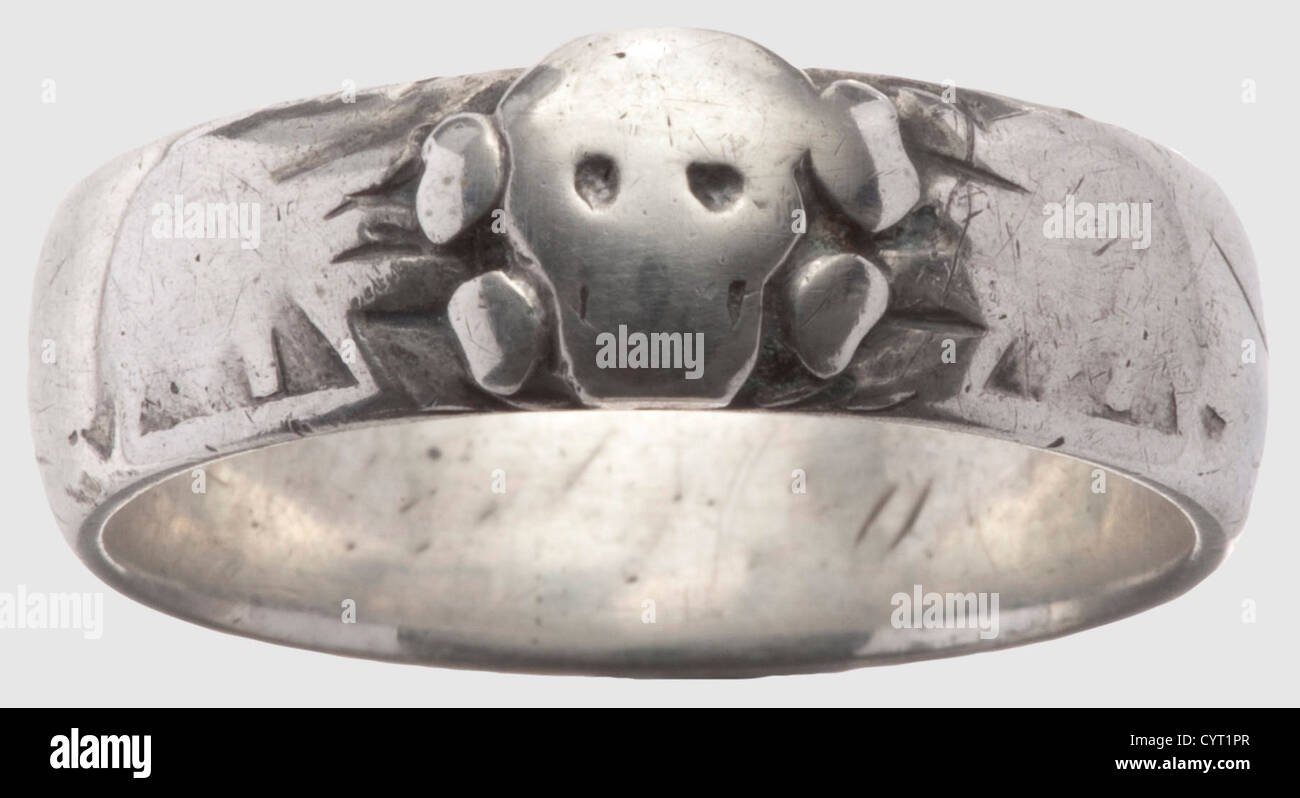 An SS death's head ring,made to measure by juweller Gahr in Munich Silver,soldered beneath the separately applied death's head. Remnants of the dedication engraving on the inside. Weight: 6.53 g. Heavy wear marks. The exterior is almost entirely rubbed,historic,historical,1930s,1930s,20th century,Waffen-SS,armed division of the SS,armed service,armed services,NS,National Socialism,Nazism,Third Reich,German Reich,Germany,military,militaria,utensil,piece of equipment,utensils,object,objects,stills,clipping,clippings,cut out,cut-out,c,Additional-Rights-Clearences-Not Available Stock Photo