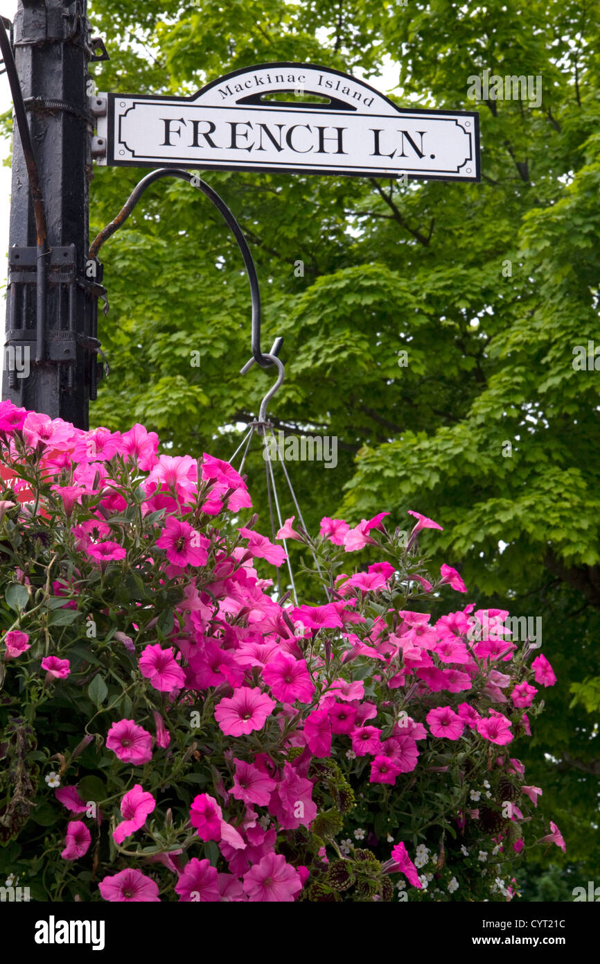 French Lane street sign and hanging flower basket on Mackinac Island located in Lake Huron, Michigan, USA. Stock Photo
