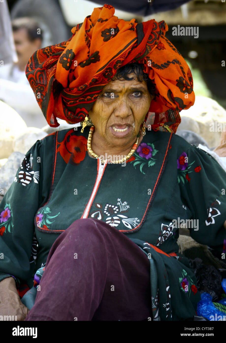 Old Woman With Orange Scarf, Jewels And Kohl, Jebel Saber, Taiz, Yemen Stock Photo