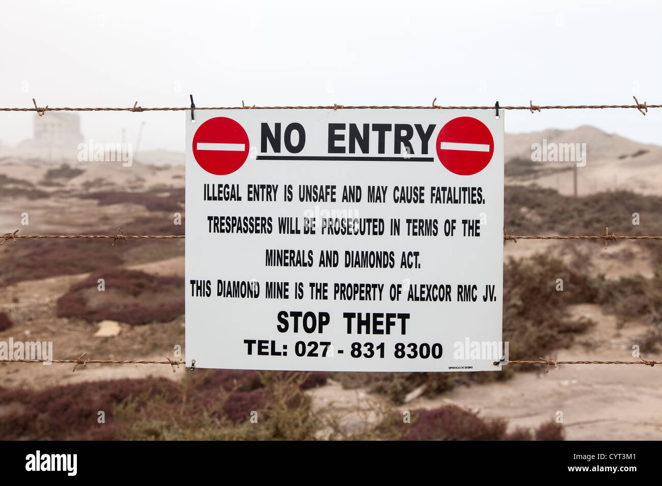 Warning sign at boundary of diamond-mining area, Port Alexander, South Africa. Stock Photo
