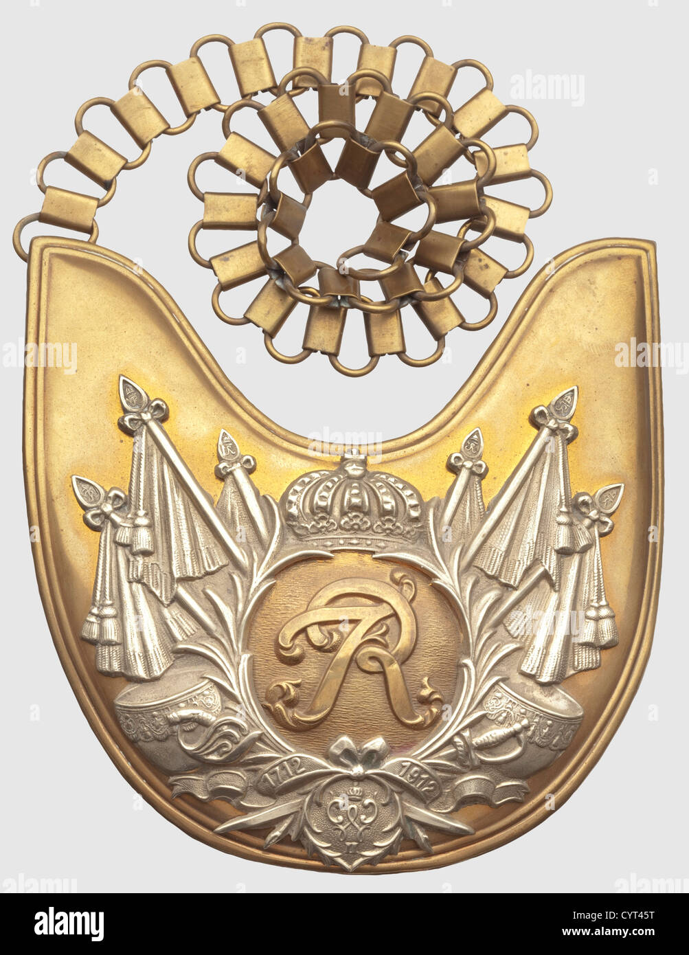 A gorget M 1912 for enlisted men,of the Regiment Garde du Corps Brass shield with white copper overlay which in turn has an applied 'FR' cipher in gold,military trophies and the years '1712','1912' and a 'WII' cipher. The emblem secured with screw-nuts on the reverse,on the retaining clamp 'G.d.C.4.6.',the lower clamp with 'C. E. JUNCKER BERLIN'. On a 46-cm length of tombak chain for wear,historic,historical,18th century,Prussian,Prussia,German,Germany,militaria,military,object,objects,stills,clipping,clippings,cut out,cut-out,cut-outs,in,Additional-Rights-Clearences-Not Available Stock Photo