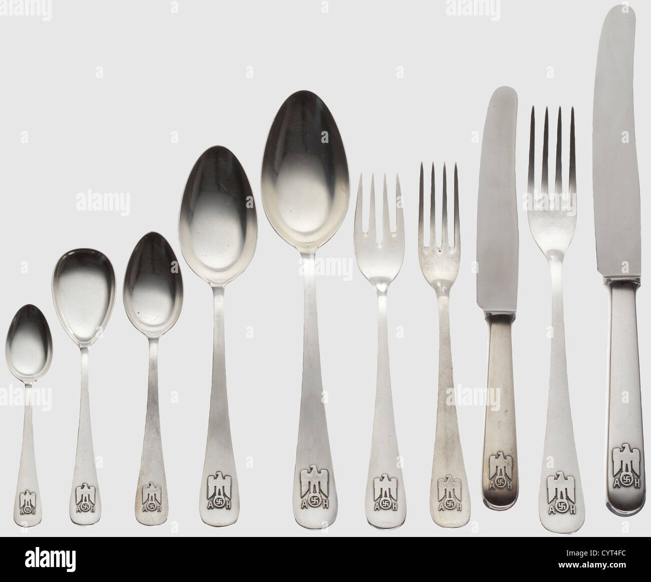 Adolf Hitler,twelve pieces from his personal silverware in the Berghof Consists of serving knives with a steel blade,serving forks and spoons. Knife with a steel blade,three forks and a spoon. Fish fork. Desser,sugar,and mocha spoons.The smooth grips with the national eagle in relief surmounting the monogram 'AH',and the hallmark '800' with crescent moon and crown. Lengths between 11 and 25.5 cm,total weight 561 g,historic,historical,1930s,1930s,20th century,NS,National Socialism,Nazism,Third Reich,German Reich,Germany,German,National Social,Additional-Rights-Clearences-Not Available Stock Photo
