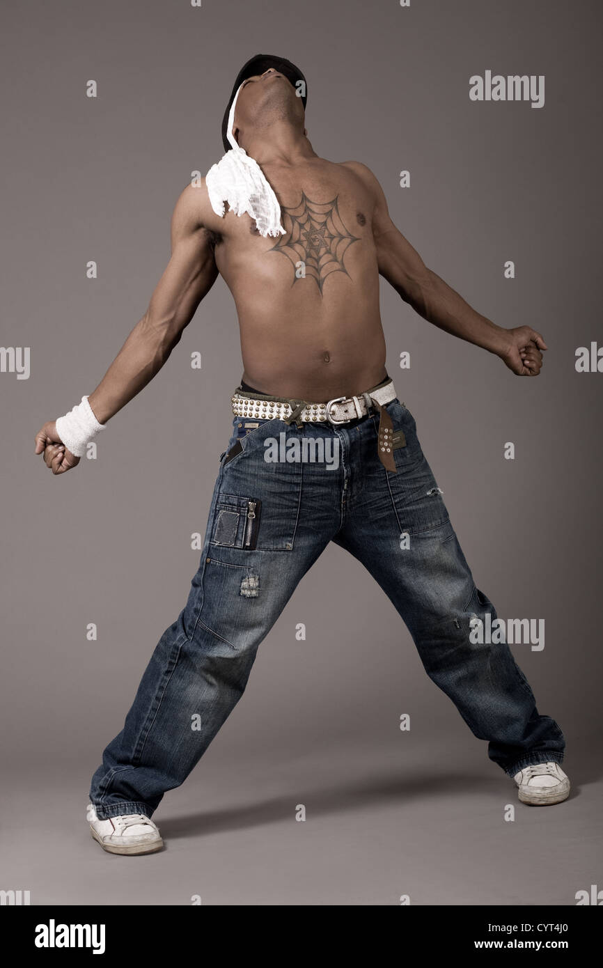 Modern dancer enjoy his dance on grey background Stock Photo - Alamy
