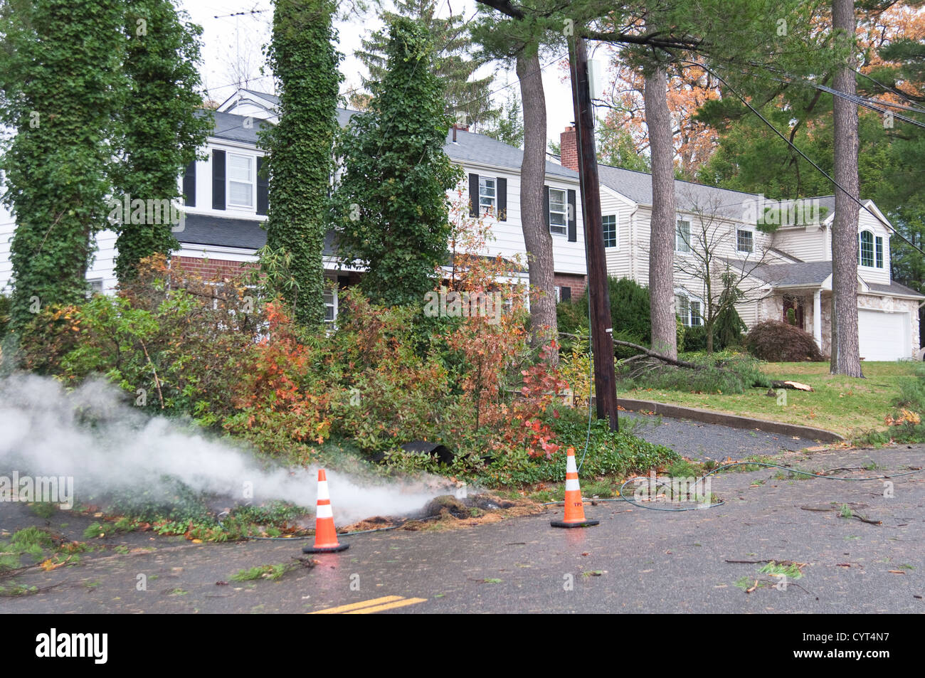 A dangerous electricity cable remains live and hangs smoking on the ...