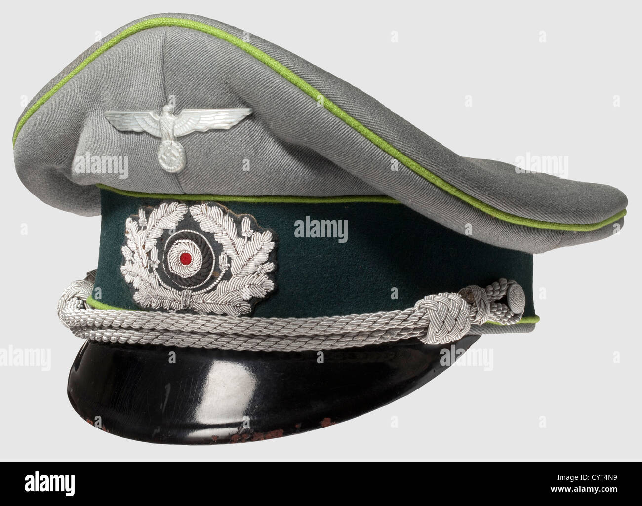 A visor cap,for an officer of the panzer grenadiers Of field-grey gabardine with dark green cap band,field green piping,silver cap cord and aluminum insignia. Orange-brown silk liner,slightly spotted with lozenge-shaped salino. Light brown inside,medium brown leather sweat band with maker information 'Deutsches Leder' and 'HB39' stamp inside. Moth holing to the cap band and cockade,otherwise in good condition. A rare later cap for this branch,historic,historical,1930s,1930s,20th century,mechanised infantry,mechanized infantry,branch of service,br,Additional-Rights-Clearences-Not Available Stock Photo