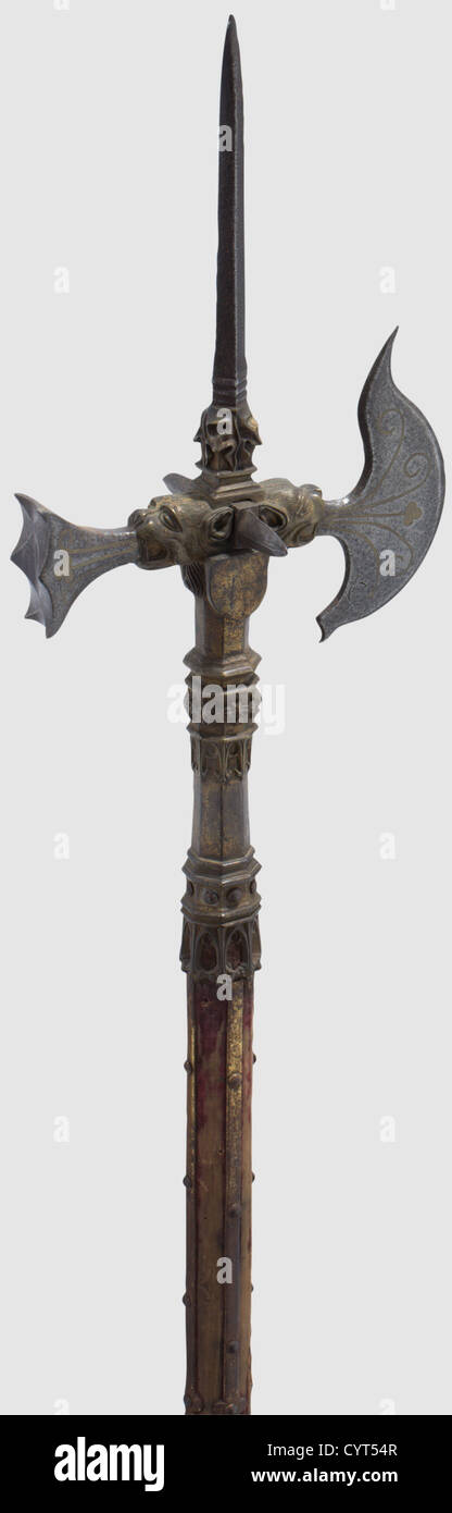 An English pole axe King Henry VIII,Tudor style,mid-19th century Head in strong relief made from gilt bronze with cast-in iron thrusting spike,axe blade and hammer head,two iron pikes on the sides. Parts of the blades with inlaid copper decorations. Octagonal socket with rich Gothic tracery decoration. The haft with the original velvet lining(strongly rubbed)and gilt side straps. Richly studded,iron shoe. Length 215 mm. Sophisticated copy of the famous pole axe of King Henry VIII,historic,historical,19th century,pole weapon,weapons,arms,weapon,ar,Additional-Rights-Clearences-Not Available Stock Photo