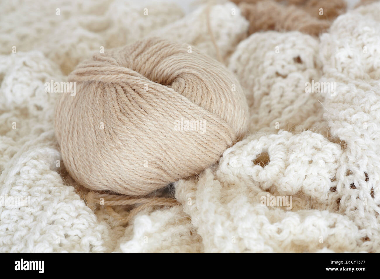 Wool yarn ball on knitted background Stock Photo - Alamy