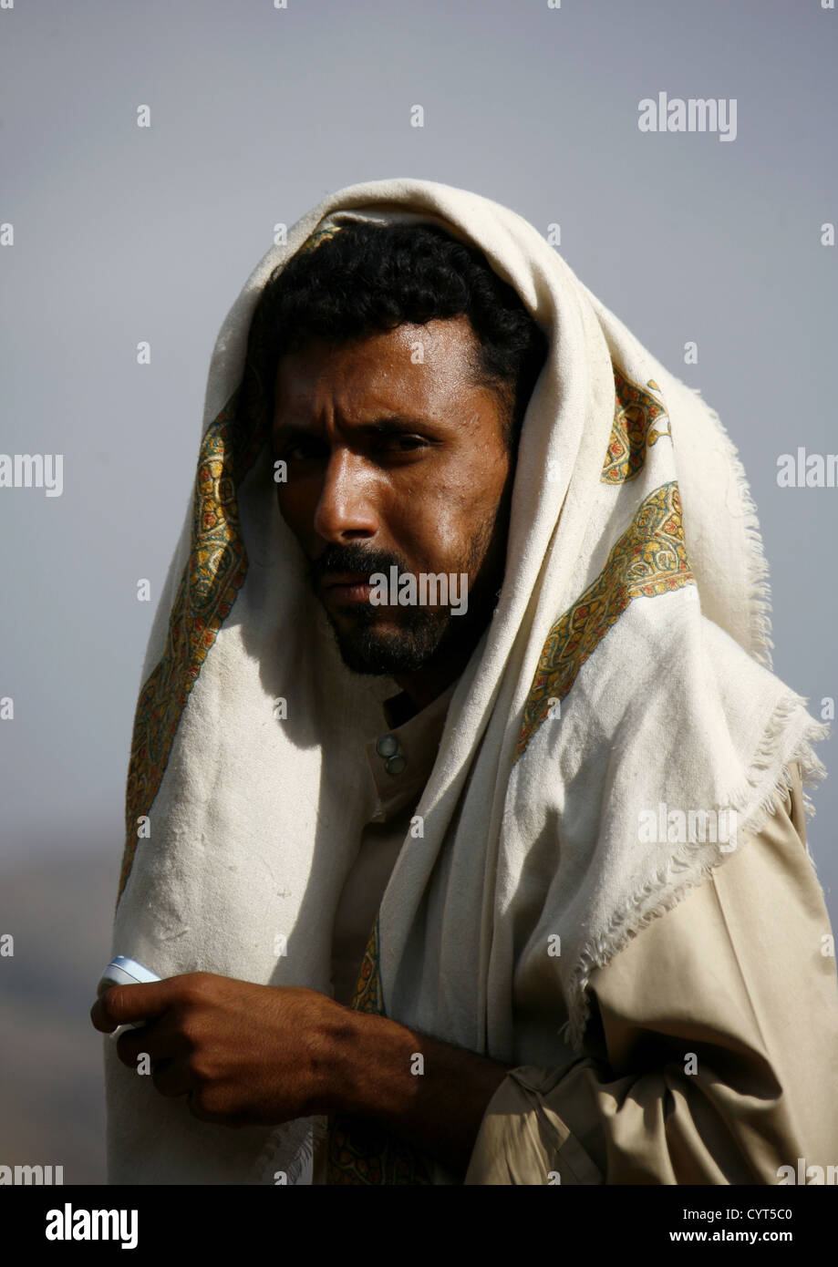 Man Chewing Khat With Traditional Scarf And Mobile Phone, Shahara