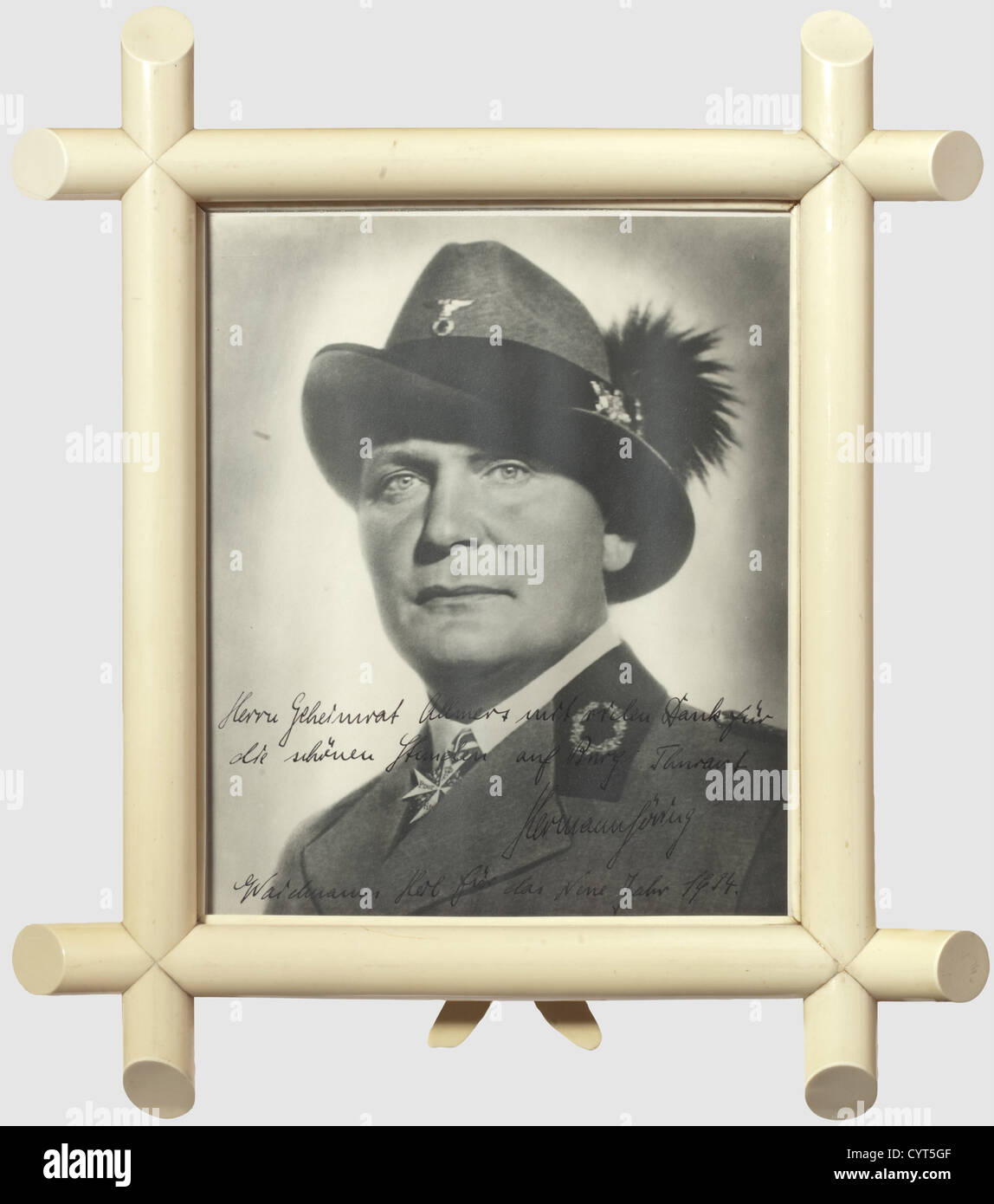 Hermann Göring, a large format photo dedicated to Privy Councillor Robert Allmers 1933/34 A portrait photograph of Göring in the hunting coat of the Reich hunting association wearing the Pour le mérite. There is a thick ink dedication on the lower edge, 'Herrn Geheimrat Allmers mit vielem Dank für die schönen Stunden auf Burg Thurant - Hermann Göring - Waidmanns Heil für das Neue Jahr 1934.' (To Privy Councillor Allmers with many thanks for the lovely hours at Thurant Castle - Hermann Göring - A hunter's greeting for the New Year 1934). Dimensions of photograph, Stock Photo