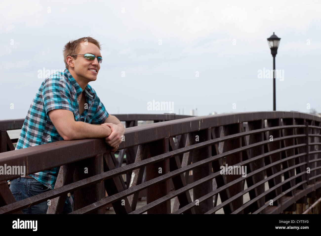 Man on Bridge Stock Photo