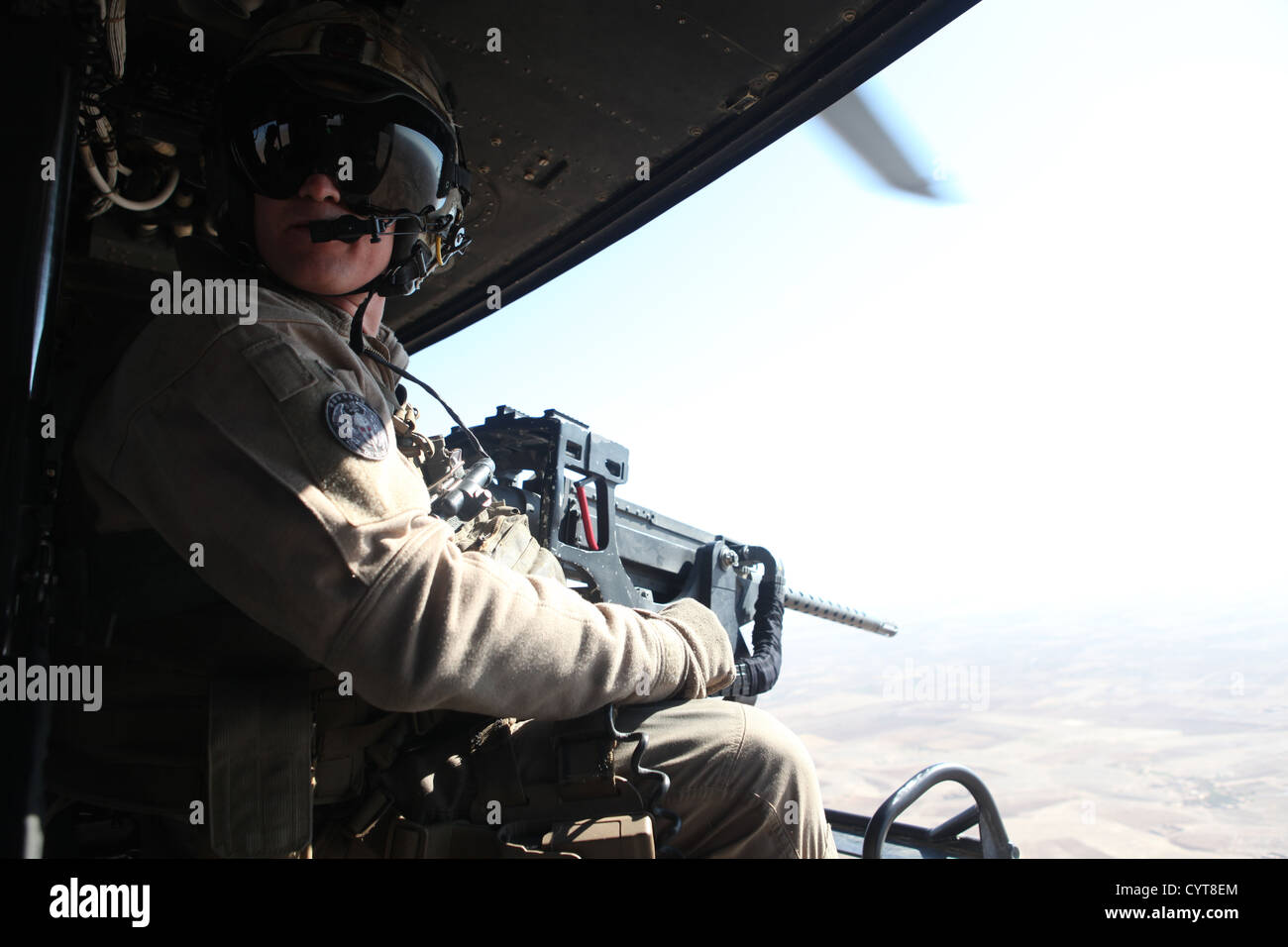 U.S. Marine Corps Cpl. Jeffery L. Allen, crew chief with Marine Light Attack Helicopter Squadron (HMLA) 469, Marine Aircraft Group 39, 3rd Marine Aircraft Wing (Forward), provides close air support over Helmand province, Afghanistan, Nov. 8, 2012. Allen p Stock Photo