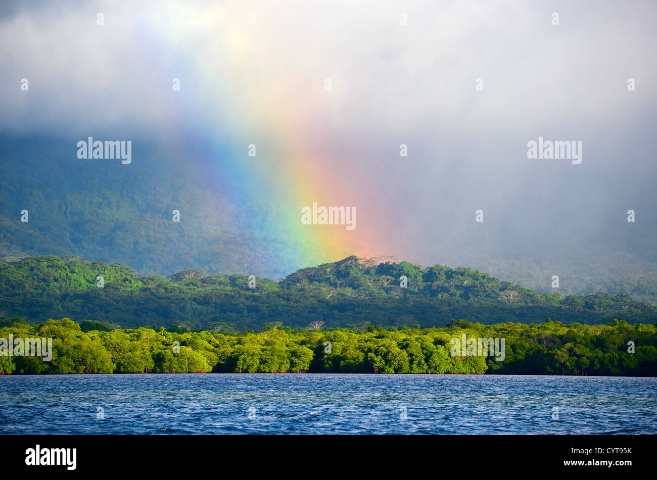 Rainbow, rain clouds, and mist, Pohnpei, Federated States of Micronesia Stock Photo