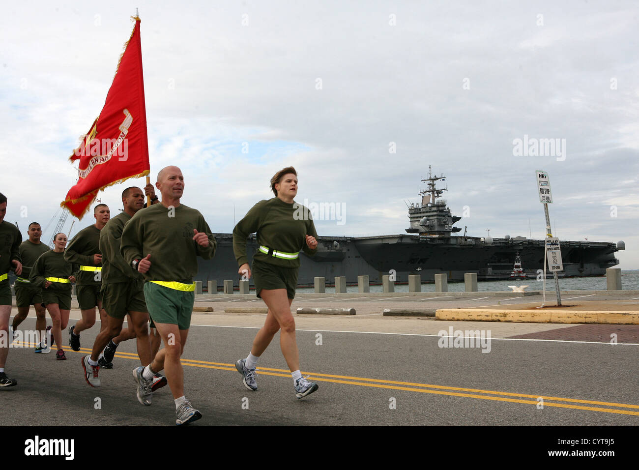 NORFOLK - Col. Susan Seaman, commanding officer, Headquarters and Service Battalion, Marine Forces Command and Sgt. Maj. Scott Helms, lead a formation run along the peir of Naval Station Norfolk to commemorate the 237th Marine Corps Birthday. Stock Photo