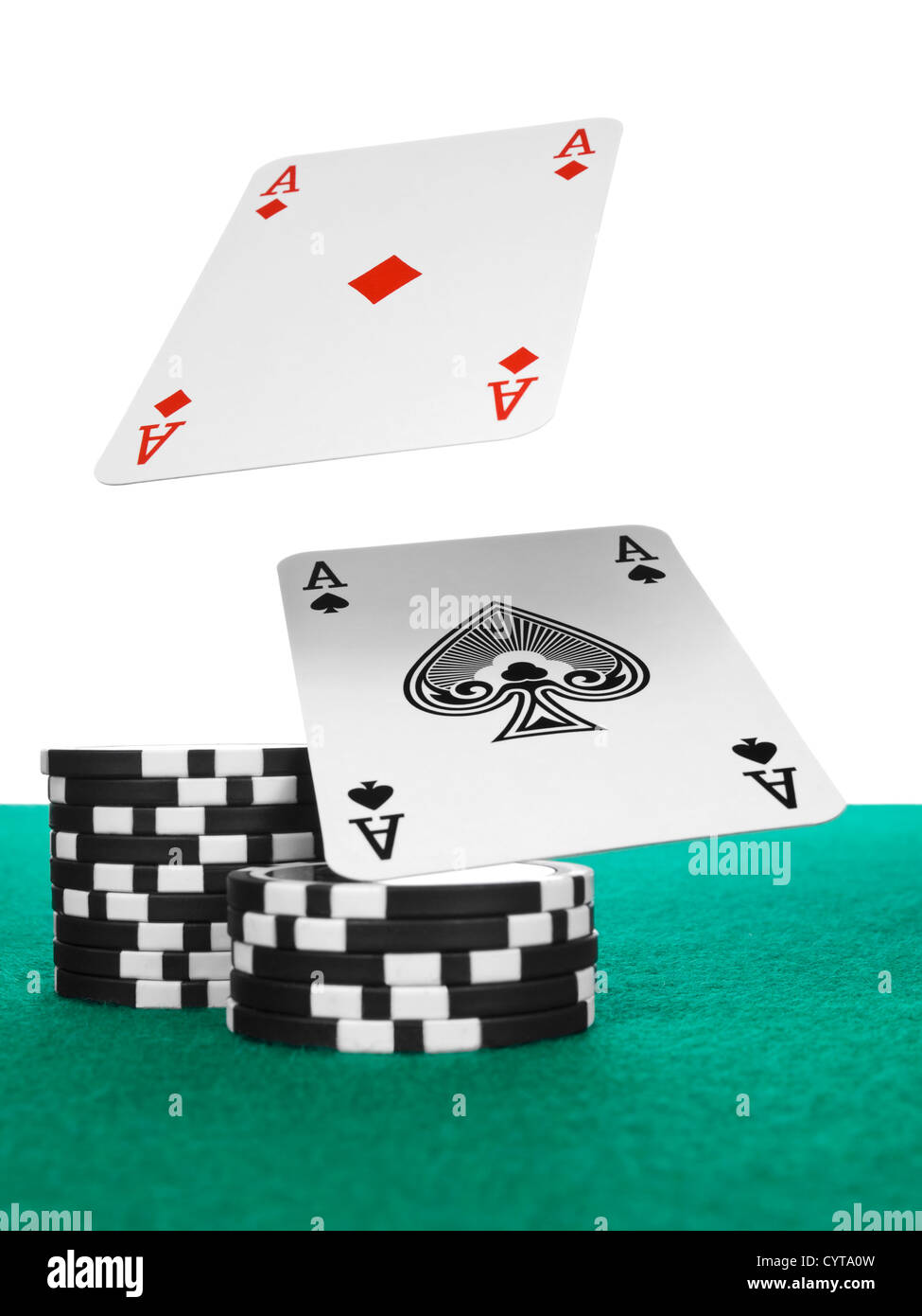 Two aces flying over a stack of chips on the poker table. Stock Photo