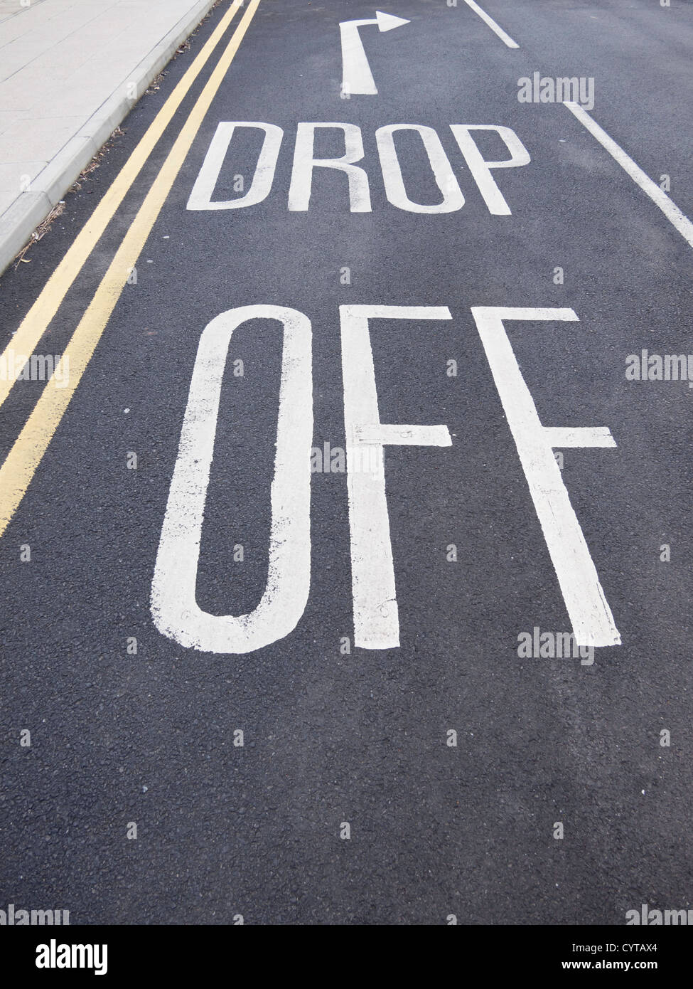 Drop Off sign road marking at a hospital to indicate a short term vehicle stopping place Stock Photo