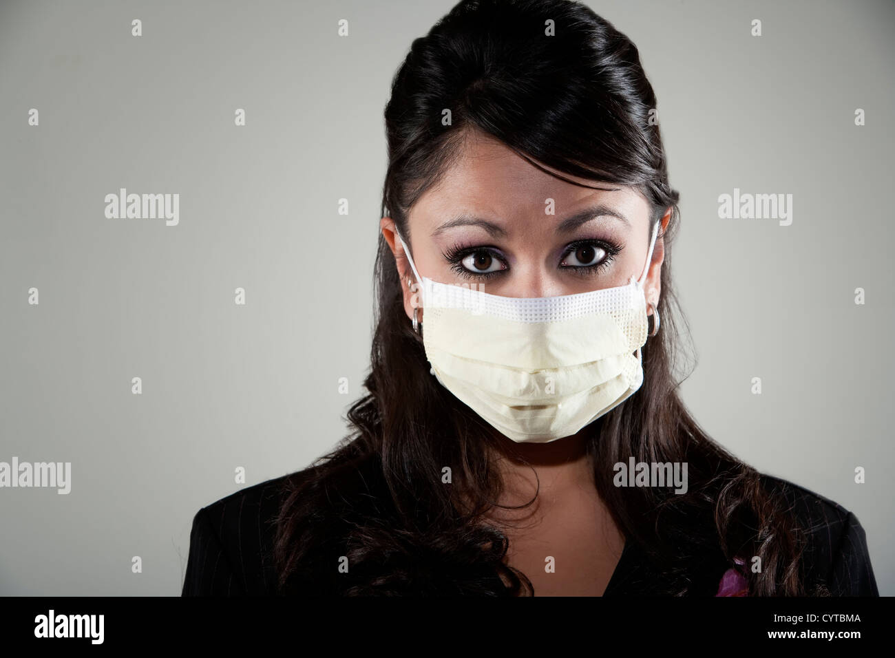 Pretty young woman wearing a breathing mask for protection from germs and viruses Stock Photo