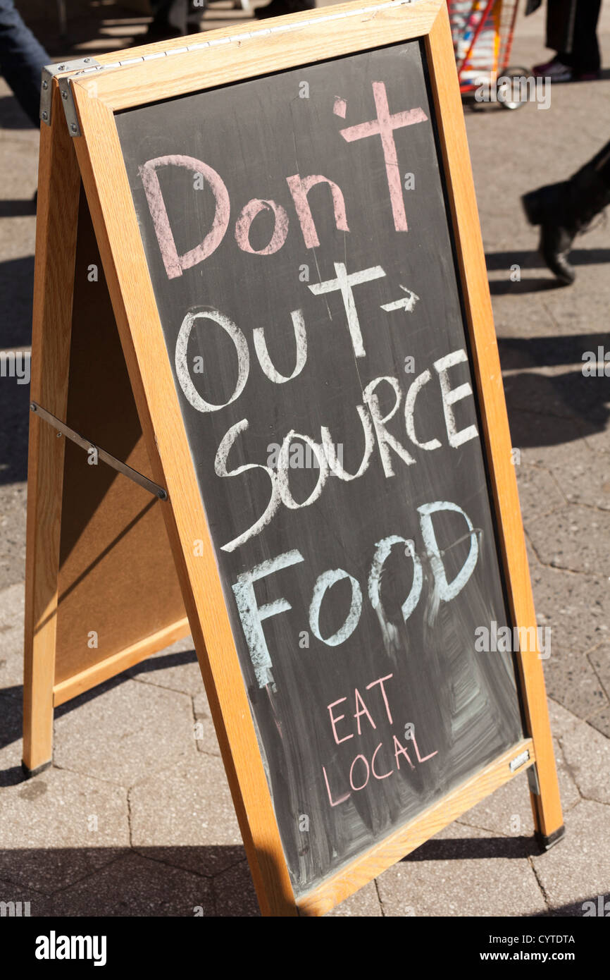 Eat Local, Don't Outsource Food sign, NYC Stock Photo